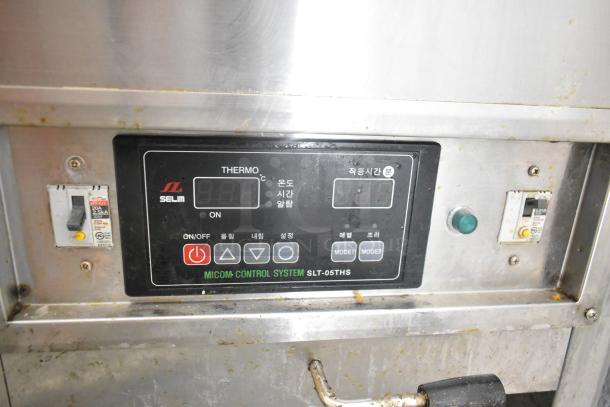 Selm SLT-05THS stainless steel steam table control panel with digital display and buttons. Mild wear visible.