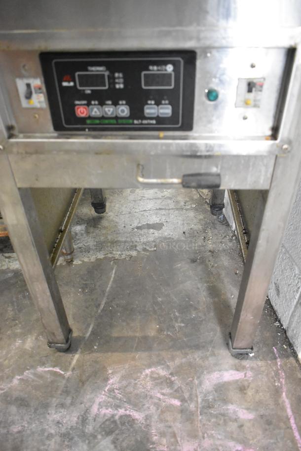 Selm SLT-05THS stainless steel commercial single bay steam table, shows control panel and lower section, industrial setting.