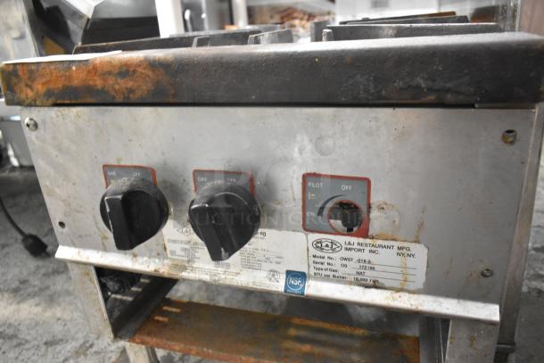 L&J OWST-018-2 stainless steel commercial single burner stock pot range with natural gas power, visible wear, model label present.