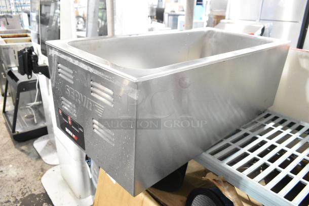BRAND NEW 2024 ServIt 423FW150L stainless steel countertop food warmer, 120 volts, minor scratches and dents visible.