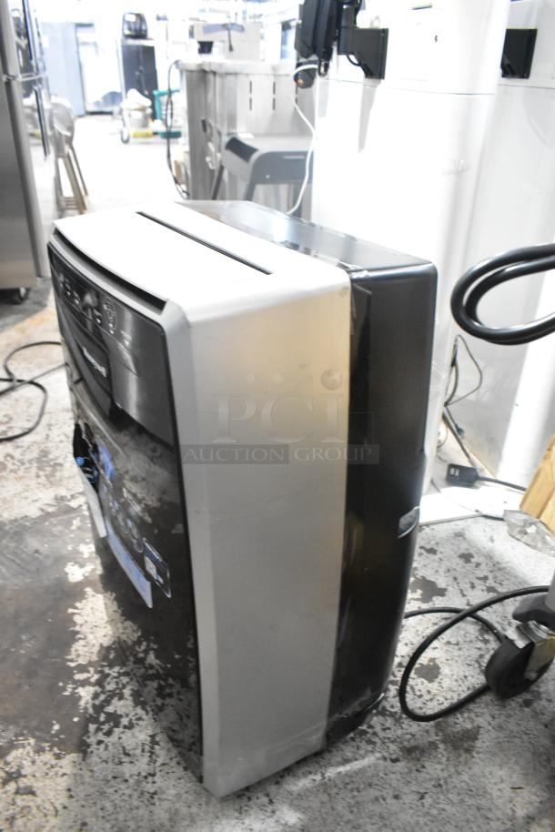 Honeywell MN10CES portable air conditioner, black and gray, 115 volts, 1 phase. Good condition, minor wear visible.