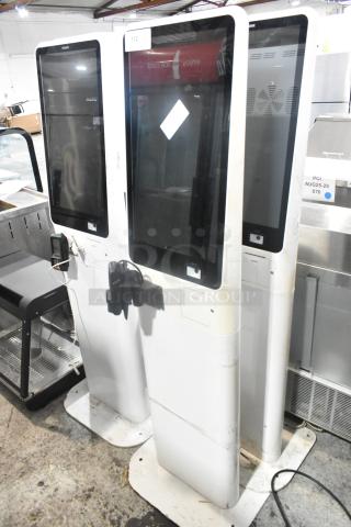 Three large BIGPOS metal floor-style POS systems. Modern design, touchscreens, slight wear. Includes card readers. Model 3X.