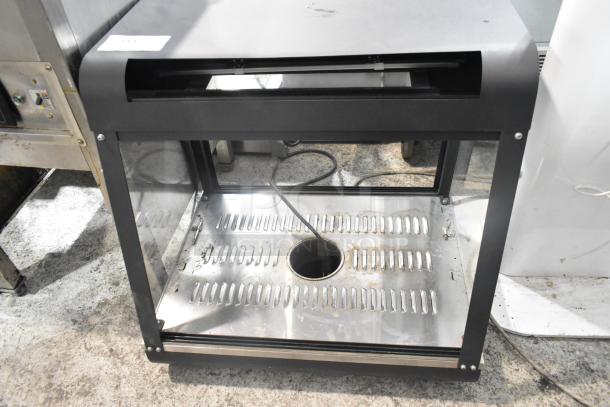 2022 Metal Commercial Countertop Heated Display Case, 110 Volts, 1 Phase, with glass panels, in used condition.