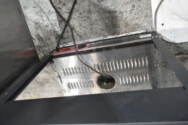 2022 metal commercial countertop heated display case, 110 volts, 1 phase, features vents and power cord, used condition.