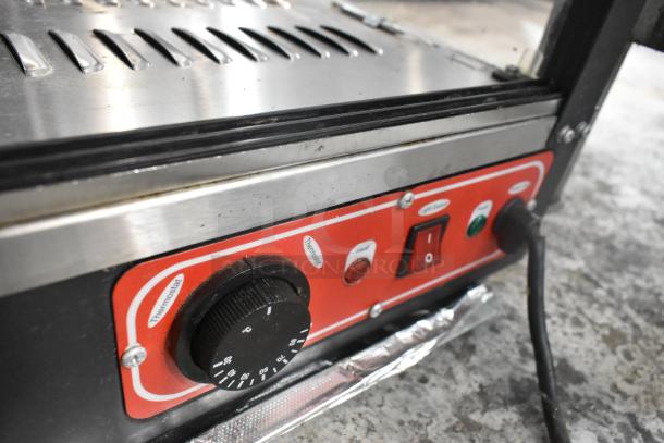 2022 metal countertop heated display case, 110 volts, 1 phase; features thermostat, heat control; good condition.