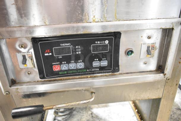 Selm SLT-05THS stainless steel steam table, commercial single bay, digital control panel, visible wear on surfaces.
