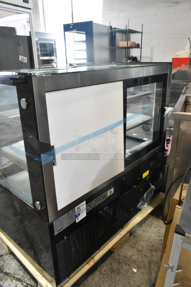 Avantco 19BC48HCB 48" curved glass black refrigerated bakery display case, brand new, scratch and dent, broken glass visible.