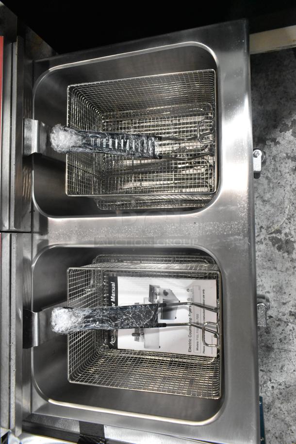 Brand new Avantco 177F202 stainless steel dual tank countertop fryer, 30 lb capacity, with two metal fry baskets and lids.