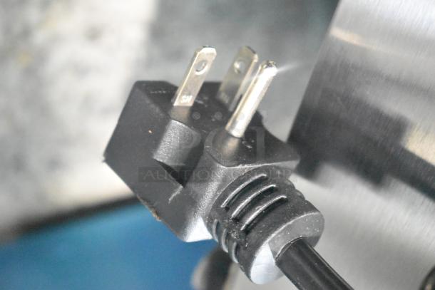 Close-up of a power plug for the Avantco 177F202 electric countertop fryer, showing its three-prong design.