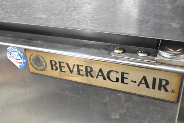 Beverage Air SPE72HC-18 stainless steel prep table close-up; features branding, made in USA label, on commercial casters.
