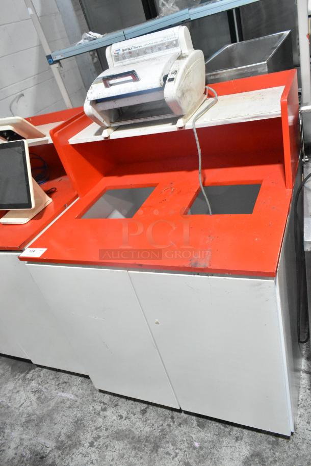 White and red double trash can shell with GMPack 3 Series Q-23 Unit on top. Some wear visible on the surface.