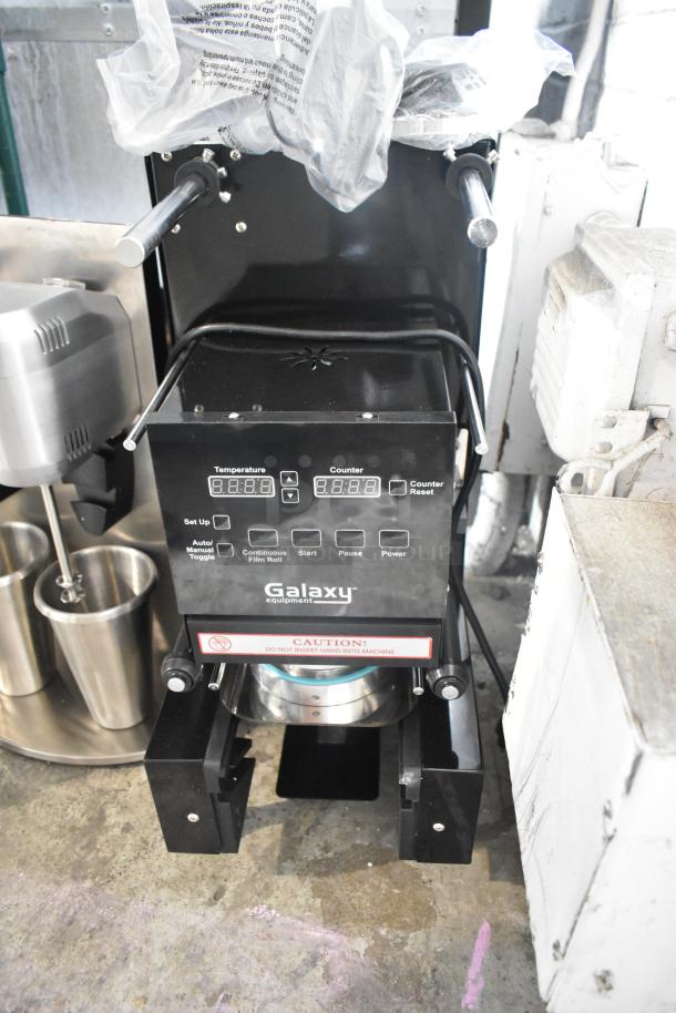 BRAND NEW 2024 Galaxy 177CSFA Cup Sealing Machine, scratch and dent condition, 88-95 mm, 110V, 1 Phase, with caution label.