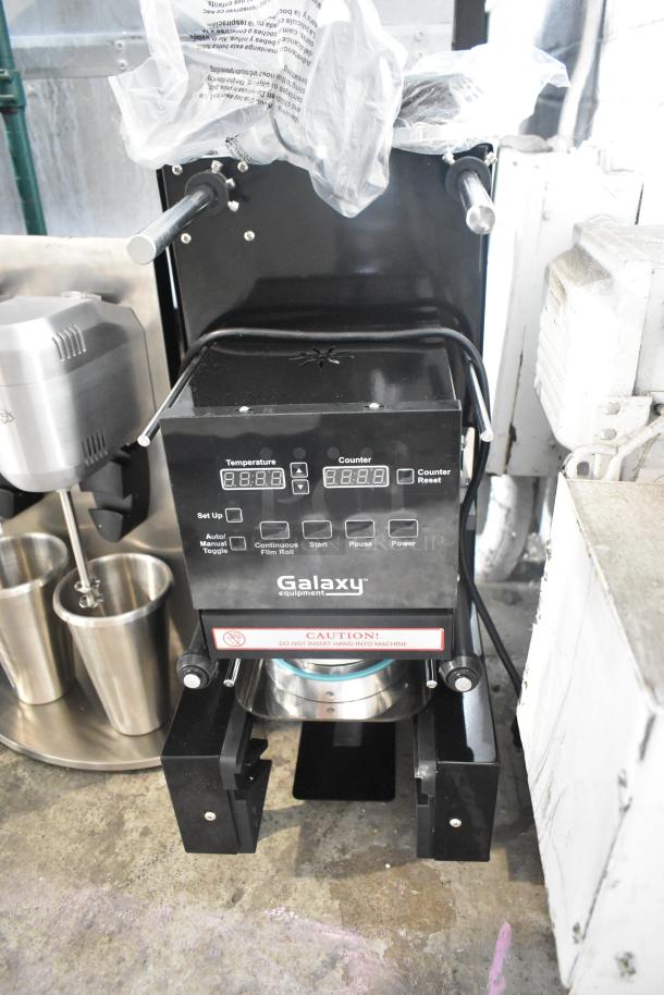 Brand new Galaxy 177CSFA automatic cup sealing machine, 2024 model, 110 volts, 1 phase, 88-95mm size. Control panel visible.