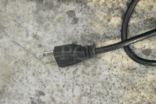 Close-up of a power cord for the AvaMix ADM2 milkshake machine, showing a standard two-prong plug.