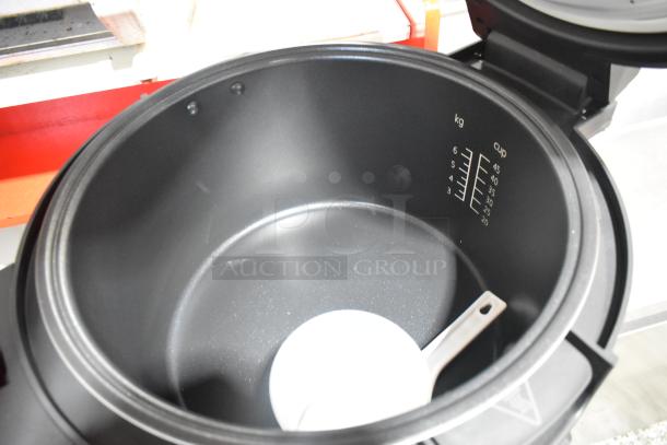 Brand new Avantco 177RCSB90 digital rice cooker, 90 cup capacity, with hinged lid. Includes measurement markings inside.