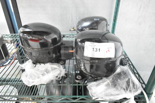 Three brand new scratch and dent compressors, models Cubigel NUT45NR, NUT70NR, Embraco EMC3140U, all for Avantco units; labeled "131 QTY x3".