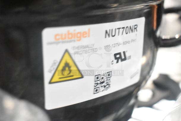 Cubigel NUT70NR compressor, thermally protected, 115-127V, 60Hz, with warning label and QR code, new condition.