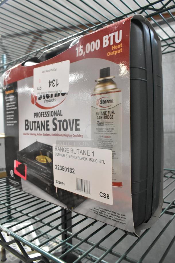 Sterno 50182 black butane stove, 15,000 BTU, brand new with packaging; slight scratches on box, includes barcode and product details.