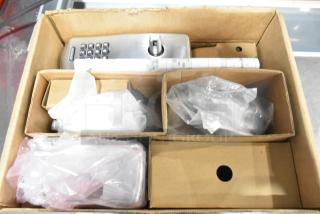 BRAND NEW SCRATCH AND DENT! CO100CY70KPSPA626BR storeroom keypad in box, visible keypad and components, some packaging.