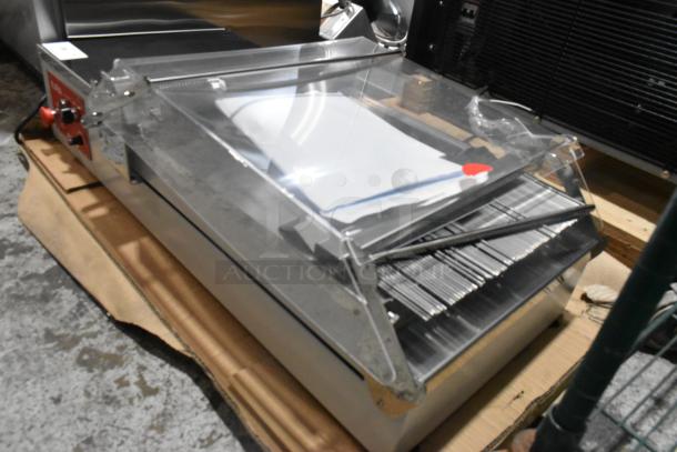 BRAND NEW! Pavoni LIRA/E110V semi-automatic dessert slicer, 110V, with protective cover. Minor scratches, great condition.