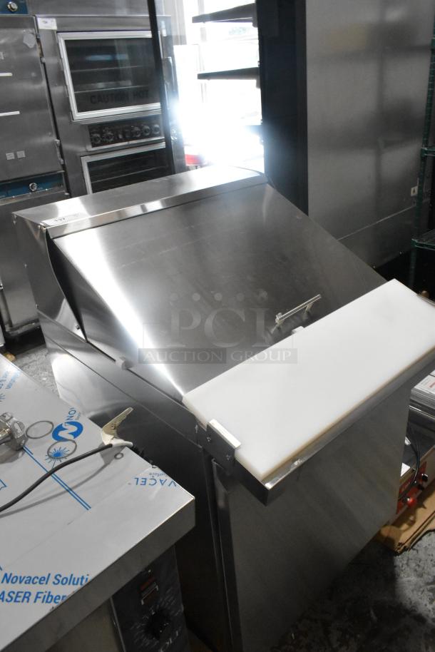 Brand new Avantco 178ZPT27MHC 27" stainless steel refrigerated prep table, front breathing, on commercial casters.