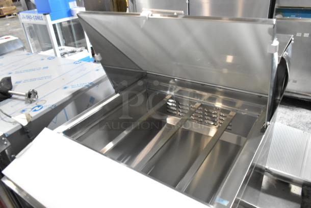 Avantco 178ZPT27MHC stainless steel mega top refrigerated sandwich prep table. New, scratch and dent, on casters.