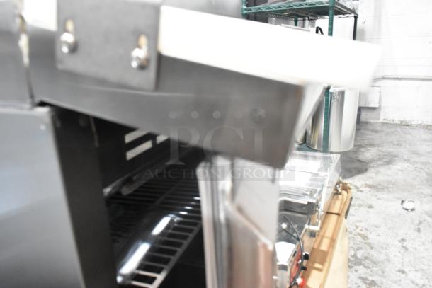 2024 Avantco 178ZPT27MHC stainless steel refrigerated sandwich prep table, scratch and dent, on commercial casters.