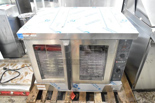 Brand new Wolf WC4GD-21D3 stainless steel commercial convection oven, liquid propane, 50,000 BTU, view-through doors, metal racks.