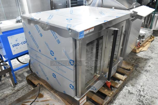 Brand new Wolf WC4GD-21D3 stainless steel convection oven with view-through doors, metal racks, and thermostatic controls.