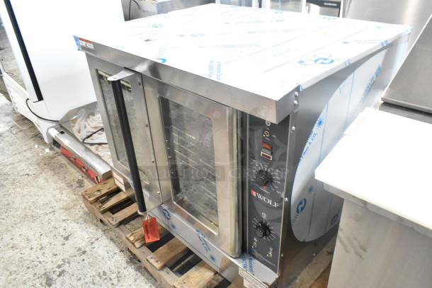 Brand new Wolf WC4GD-21D3 stainless steel commercial convection oven, scratch and dent, with view-through doors and thermostatic controls.