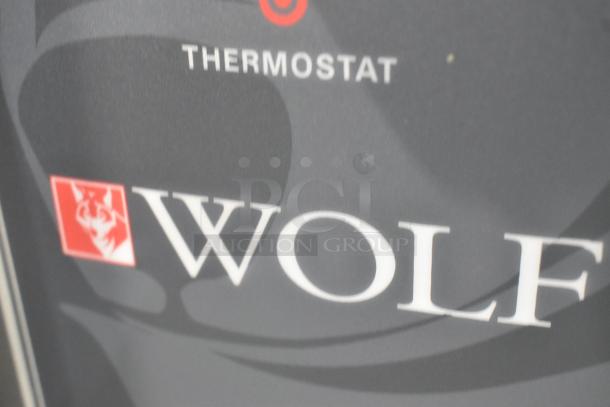 Wolf WC4GD-21D3 convection oven label, featuring brand logo and "THERMOSTAT" text in gray and red.