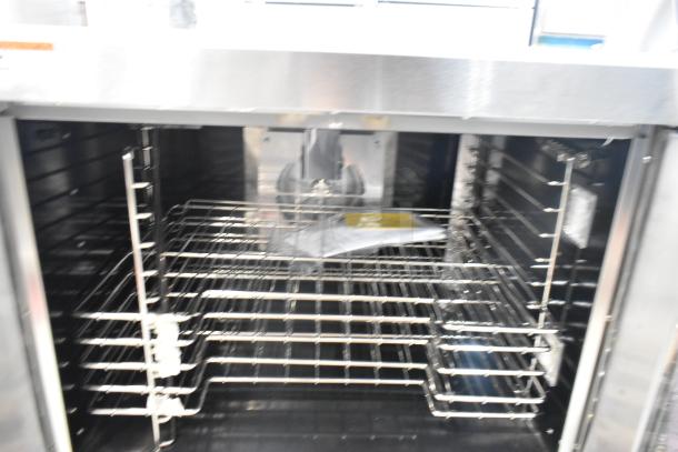 Brand new Wolf WC4GD-21D3 stainless steel convection oven, view-through doors, metal racks, thermostatic controls, 50,000 BTU.