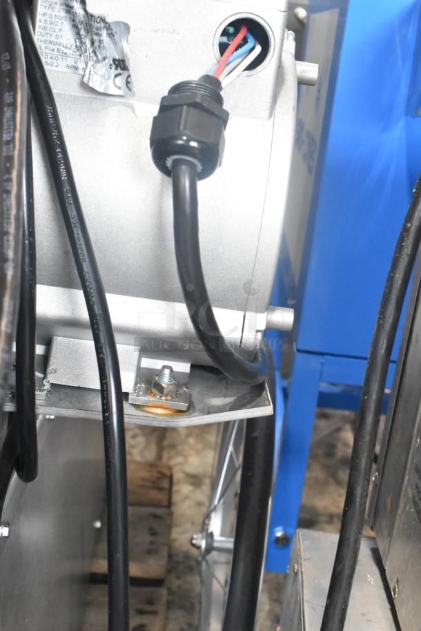 Close-up of internal components of a Wolf WC4GD-21D3 convection oven. Wiring and labels are visible, indicating electrical connections.