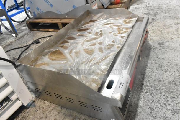 Brand new Avantco 177EG30N 30" electric countertop griddle. Stainless steel with scratch and dent. 208/240 volts, 1 phase.