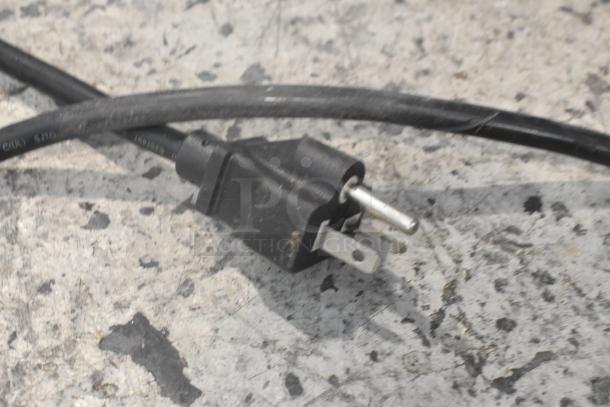 Electric cord for Avantco 177EG30N Stainless Steel 30" Electric Countertop Griddle, shown on a textured surface.