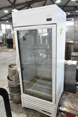 Brand new True Metal commercial single door reach-in cooler with poly-coated racks. Scratch and dent. 115 volts, 1 phase.