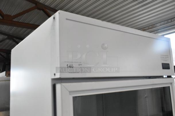 BRAND NEW True Metal Single Door Cooler Merchandiser, scratch and dent, with poly coated racks, 115V, 1 Phase. Label: "140 QTY PCIAuctions.com".