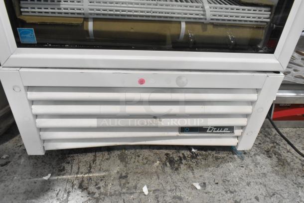 Brand new True single door reach-in cooler, scratch and dent, with poly-coated racks, 115V, 1 phase, Energy Star label.