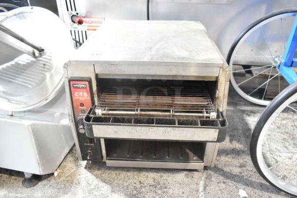 Waring CTS1000 Stainless Steel Conveyor Toaster Oven, 120V, 1 Phase, used condition, visible brand label, commercial design.
