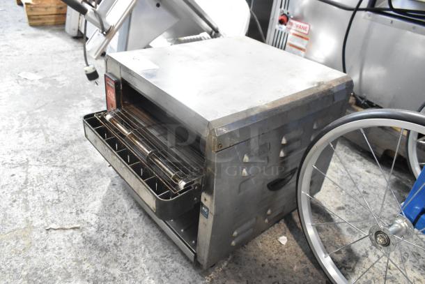 Waring CTS1000 stainless steel commercial conveyor toaster oven, countertop model, 120 volts, showing minor wear.
