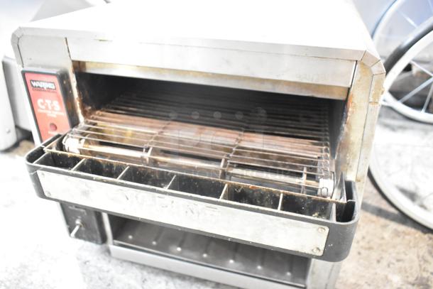 Waring CTS1000 stainless steel commercial conveyor toaster oven, 120V, used. Model plaque visible.