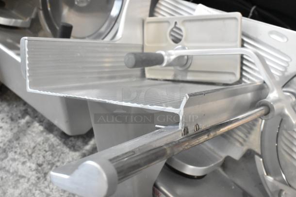 Bizerba GSP metal commercial countertop meat slicer, 115 volts, 1 phase. Features adjustable blade and sturdy construction.