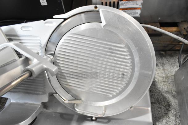 Bizerba GSP metal meat slicer, commercial countertop model, 115 volts, 1 phase, used condition, visible safety labels.