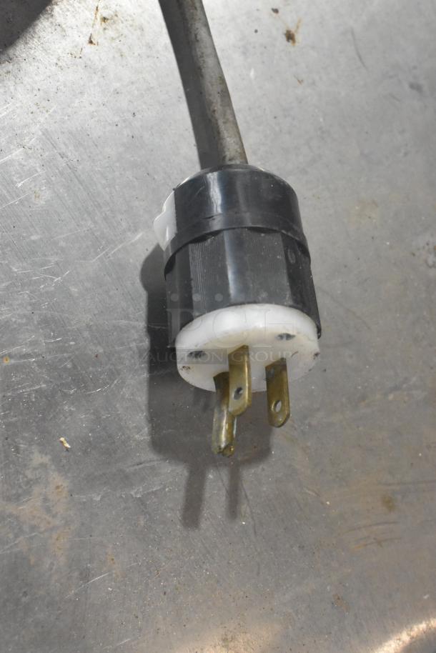 Power cord plug for Bizerba GSP Metal Commercial Countertop Meat Slicer, 115 Volts, 1 Phase, on a metal surface.