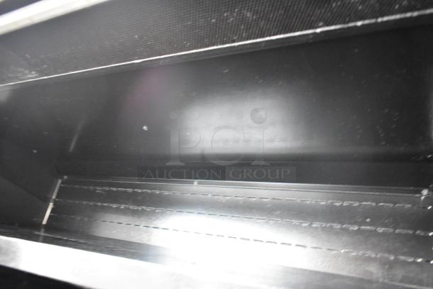 Master Bilt black metal open air grab-n-go merchandiser interior view, showing shelves. 115 Volts, 1 Phase.