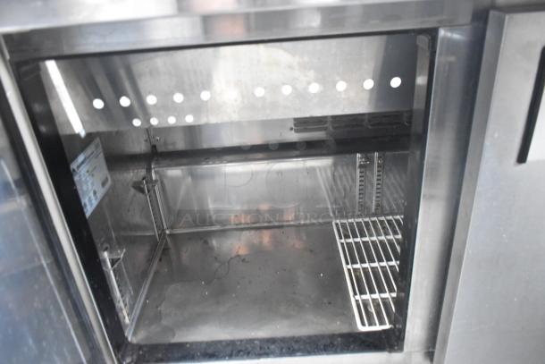 Everest EPBR2 stainless steel prep table interior, features commercial casters, visible labels. 115V, 1 phase. Good condition.