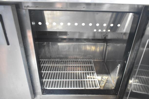 Everest EPBR2 stainless steel prep table interior. Used, shows shelf and metal finish. 115V, 1 phase, on casters.