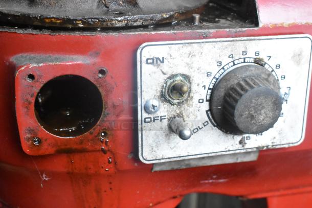 Hobart A-200 commercial 20-quart dough mixer control panel, worn with visible rust, knob, and switch.