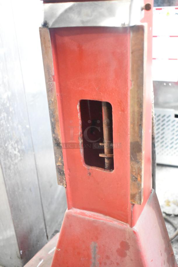 Hobart A-200 20 Quart Metal Dough Mixer base, red, rust spots visible, durable commercial model, no markings shown.