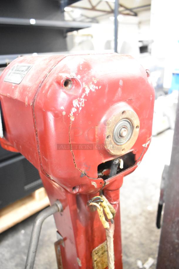 Hobart A-200 metal commercial 20-quart dough mixer, red, visible wear and scratches, model label on top.